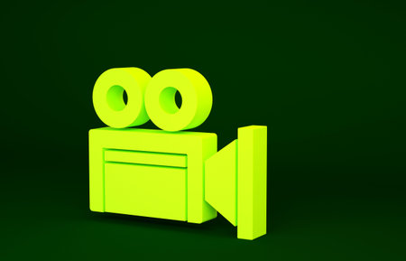 Yellow Cinema camera icon isolated on green background. Video camera. Movie sign. Film projector....