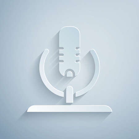 Paper cut Microphone icon isolated on grey background. On air radio mic microphone. Speaker sign. Paper art style. Vectorのイラスト素材