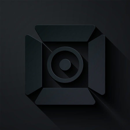 Paper cut Movie spotlight icon isolated on black background. Light Effect. Scene, Studio, Show. Paper art style. Vectorのイラスト素材