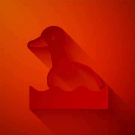 Paper cut Flying duck icon isolated on red background. Paper art style. Vectorのイラスト素材
