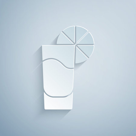 Paper cut Tequila glass with lemon icon isolated on grey background. Mexican alcohol drink. Paper art style. Vectorのイラスト素材