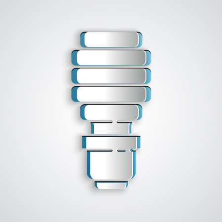 Paper cut LED light bulb icon isolated on grey background. Economical LED illuminated lightbulb. Save energy lamp. Paper art style. Vectorのイラスト素材