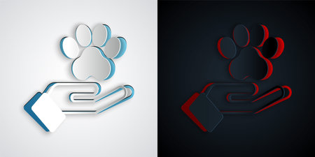 Paper cut Hands with animals footprint icon isolated on grey and black background. Pet paw in heart. Love to the animals. Paper art style. Vectorのイラスト素材
