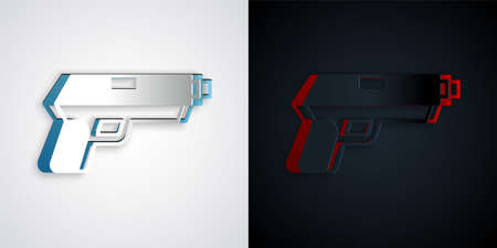 Paper cut Pistol or gun icon isolated on grey and black background. Police or military handgun. Small firearm. Paper art style. Vectorのイラスト素材