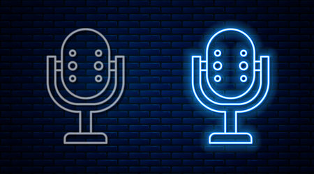 Glowing neon line Microphone icon isolated on brick wall background. On air radio mic microphone. Speaker sign. Vectorのイラスト素材