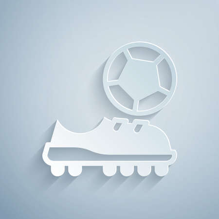 Paper cut Football shoes icon isolated on grey background. Soccer boots. Sport football foot protection. Paper art style. Vectorのイラスト素材