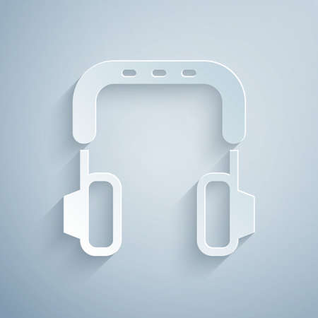 Paper cut Headphones icon isolated on grey background. Earphones. Concept for listening to music, service, communication and operator. Paper art style. Vectorのイラスト素材
