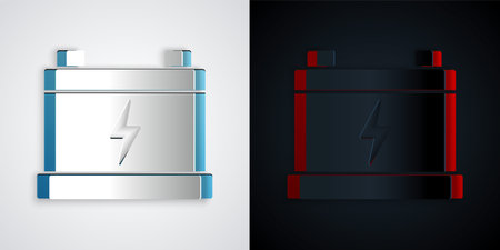 Paper cut Car battery icon isolated on gray and black background. Accumulator battery energy power and electricity accumulator battery. paper art style. Vectorのイラスト素材