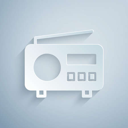 Paper cut Radio with antenna icon isolated on grey background. Paper art style. Vectorのイラスト素材