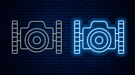 Glowing neon line Photo camera for diver icon isolated on brick wall background. Foto camera icon....
