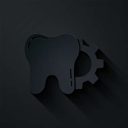 Paper cut Tooth treatment procedure icon isolated on black background. Tooth repair with gear. Paper art style. Vectorのイラスト素材