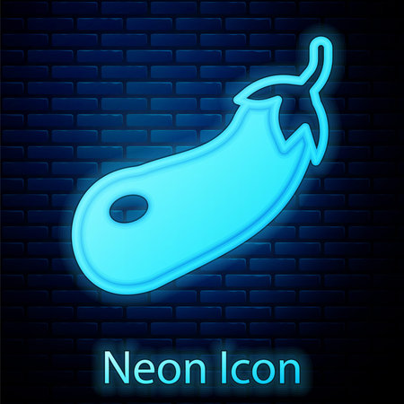 Glowing neon Eggplant icon isolated on brick wall background. Vectorのイラスト素材