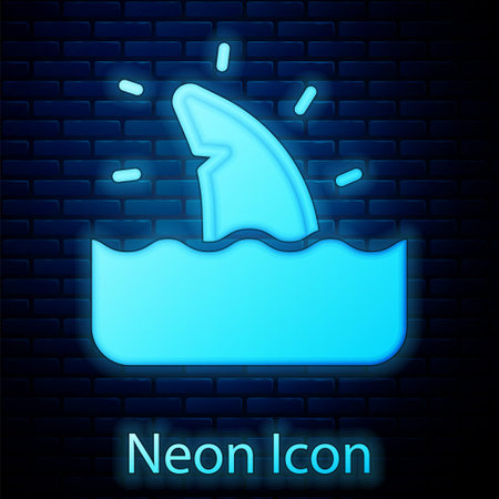 Glowing neon Shark fin in ocean wave icon isolated on brick wall background. Vectorのイラスト素材