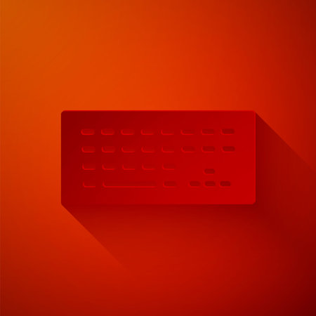 Paper cut Computer keyboard icon isolated on red background. PC component sign. Paper art style. Vectorのイラスト素材
