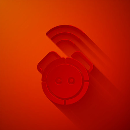 Paper cut Robot vacuum cleaner icon isolated on red background. Home smart appliance for automatic vacuuming, digital device for house cleaning. Paper art style. Vectorのイラスト素材