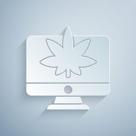 Paper cut Computer monitor and medical marijuana or cannabis leaf icon isolated on grey background. Online buying. Supermarket basket. Paper art style. Vector Illustrationのイラスト素材