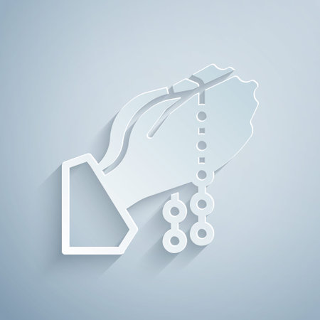 Paper cut Hands in praying position with rosary icon isolated on grey background. Praying hand islam muslim religion spirituality religious. Paper art style. Vectorのイラスト素材