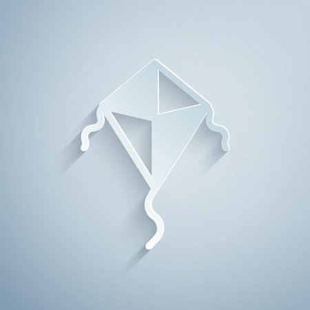 Paper cut Kite icon isolated on grey background. Paper art style. Vectorのイラスト素材