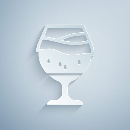 Paper cut Glass of beer icon isolated on grey background. Paper art style. Vectorのイラスト素材