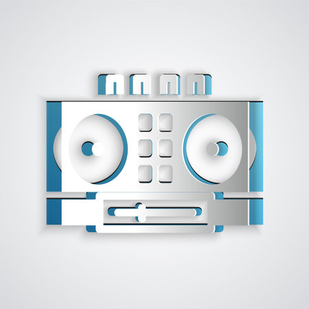 Paper cut DJ remote for playing and mixing music icon isolated on grey background. DJ mixer complete with vinyl player and remote control. Paper art style. Vectorのイラスト素材