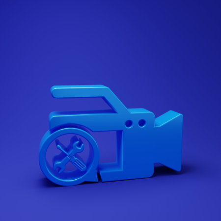 Blue Video camera with screwdriver and wrench icon isolated on blue background. Adjusting, service, setting, maintenance, repair, fixing. Minimalism concept. 3D render illustration.の写真素材