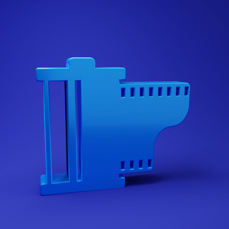 Blue Camera vintage film roll cartridge icon isolated on blue background. Film reel. 35mm film canister. Filmstrip photographer. Minimalism concept. 3D render illustration.の写真素材