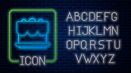 Glowing neon Cake icon isolated on brick wall background. Happy Birthday. Neon light alphabet. Vector.のイラスト素材