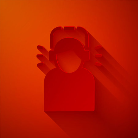 Paper cut Man in headphones icon isolated on red background. Paper art style. Vector.のイラスト素材