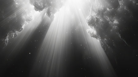 Dramatic light beams shining through dark heavensの写真素材