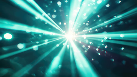 Bright cyan light beams radiating with bokeh effectの写真素材