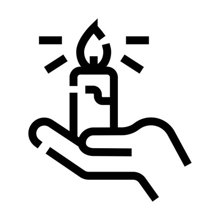 Hand holding burning candle bringing light and hopeのイラスト素材