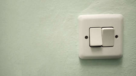 Close up On Off switch light at the wall position at the right side and empty space at left side.の写真素材