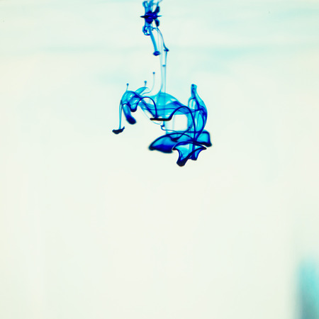 Soluble in water a drop of blue dye.の写真素材