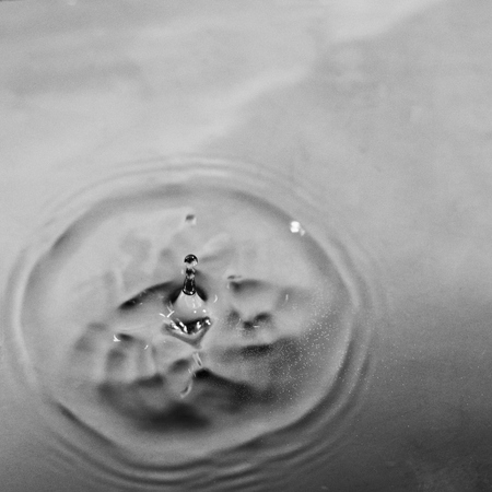 Pattern on water from falling drop.の写真素材