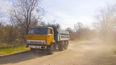 yellow track remopve debris with dustの写真素材