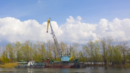crane on river loading cargo