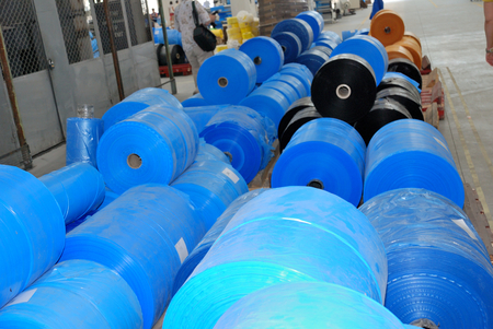 many big  rolls of blue polyethylene in wharehouseのeditorial素材