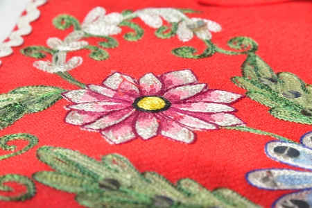 red material with flowers embroideryの写真素材