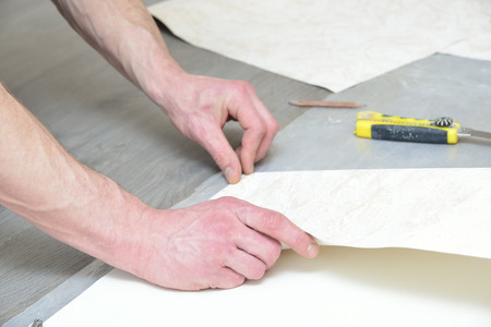 preparation for glueing wallpaper (measurement and marking)の写真素材
