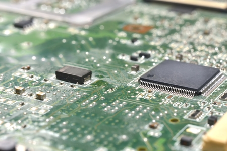 chip on motherboard (mainboard) with controllers, ports and wiresの写真素材