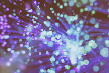 colored particles fly in space of the optical fiber and circling ( abstract blur background  )の写真素材