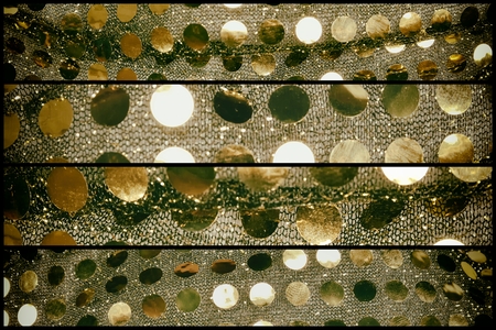 golden sequins on fabric (sewing costumes for dancing)の写真素材