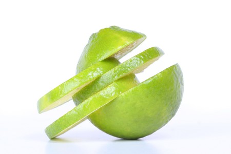 fresh green juicy lime isolated on white