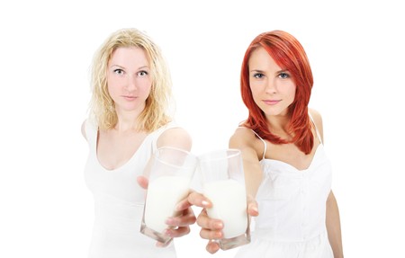 two cute girls with milkの写真素材