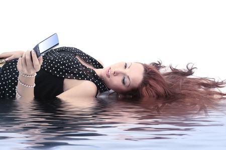 charming girl with mobileの写真素材