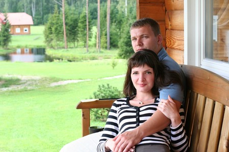 young couple relaxing on verandahの写真素材