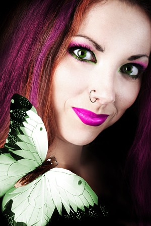 funny colored girl with butterflyの写真素材