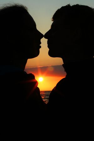 young couple kissing on the coastの写真素材