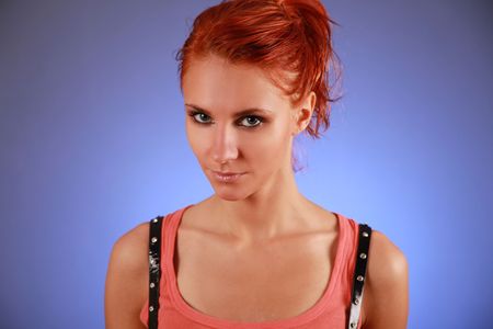 sexy redhead woman on blue backgroundの写真素材