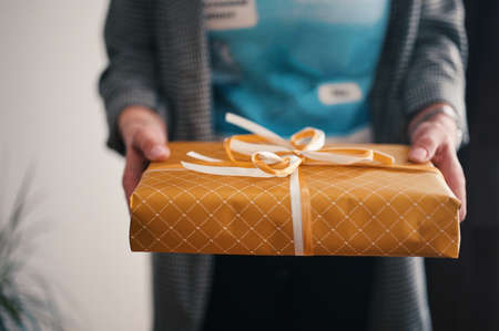 Midsection of woman holding present